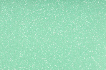 Green textured vinyl background. Full frame