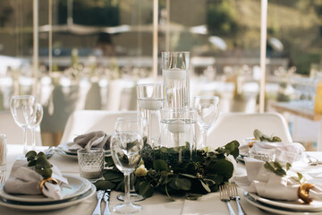 Decorated wedding table with candles and white flowers