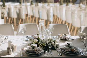Decorated wedding table with candles and white flowers