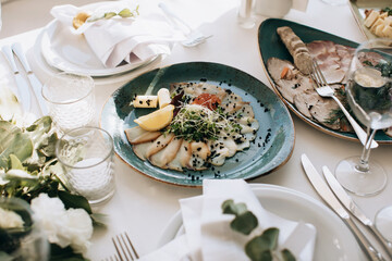 Wedding table setting with food in restaurant