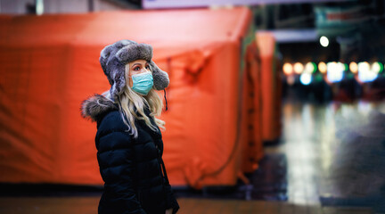 Ukrainian woman refugee. Pray for Ukraine. Stop the war in Ukraine. War refugees in the train station near tents