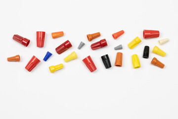 Horizontal flat layout of assorted color wire nuts on white background