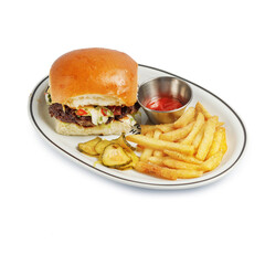 appetizing burger traditional serving on a plate with sauce and fried potatoes