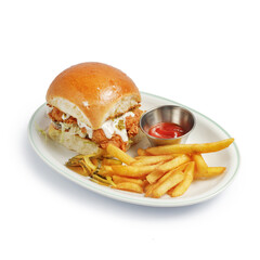 appetizing burger traditional serving on a plate with sauce and fried potatoes
