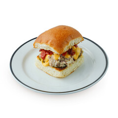 appetizing burger traditional serving on a plate with sauce and fried potatoes