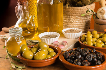 Still life with olives and extra virgin olive oil.