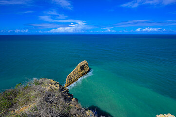 Fototapeta premium View from mountain to natural breakwater rock Dominican Republic. Tourist place