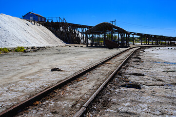 Fototapeta na wymiar A salt farm in the south of the Dominican Republic, tourist site, rusty railway