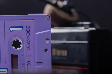 Closeup of an old vintage cassette tape against dark background