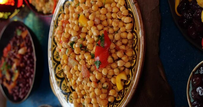 Traditional dishes for Ramadan - chickpeas with vegetables. Moroccan Cuisine dish table top