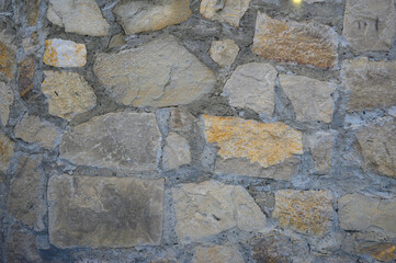 Stone wall, background in gray-yellow color, High quality photo