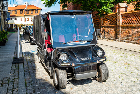 Torun, Poland - August 11, 2021. Black Melex electric car for tourists transportation