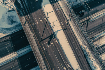 Aerial view of the highway and intersection in the city on a winter day