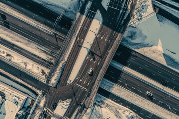Aerial view of the highway and intersection in the city on a winter day