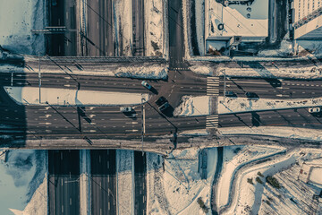 Aerial view of the highway and intersection in the city on a winter day