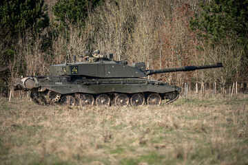 British army FV4034 Challenger 2 main battle tank with the commander and gunner directing action on a military exercise, Wiltshire UK