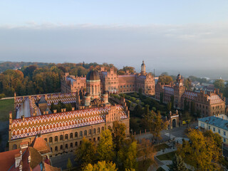 Fototapeta na wymiar City panorama from the air, shot from a drone. Yury Fedkovych national University in Chernivtsi. City morning landscape with foggy haze. UNESCO monument in Ukraine