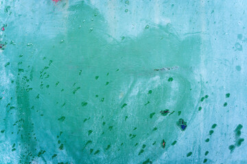 Turquoise blue aged weathered metal surface door with green rain water drops background texture
