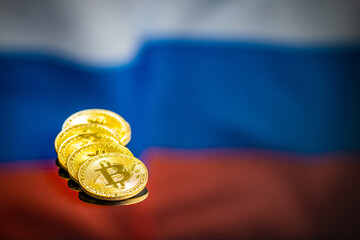 Bitcoin in front of russian flag. Digital cryptocurrency. Russian flag background.