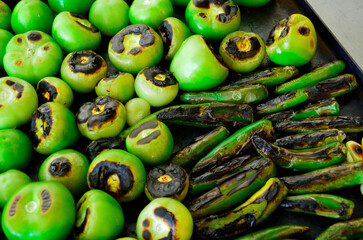 Roasting green tomato and serrano chili for a mexican green sauce