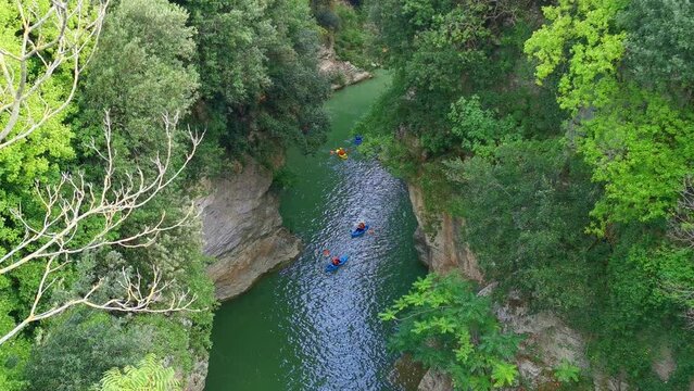 people practicing canyoning with kayaks in the Marche region at "Marmitte dei giganti", Italy