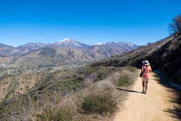 Fototapeta na wymiar A Beautiful Healthy Mature Woman Hiking on a Southern California Hill Trail