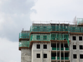 Fototapeta na wymiar PENANG, MALAYSIA -JULY 11, 2021: Apartment building is under construction. This type of residence is an option for urban areas because it is more affordable.