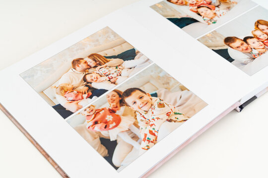 a book with photos of family at home on a white background.