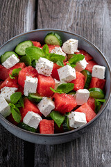 Summer salad with watermelon, mint, cucumber and feta cheese close up