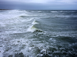 Heavy surf fueled by offshore storms pound the Outer Banks beaches
