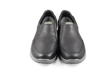 Black leather shoes isolated on white background. Full depth of field. Close-up.