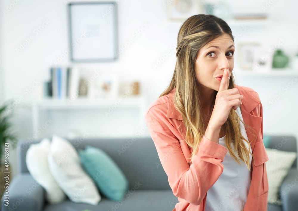 Canvas Prints Its our little secret.... cropped shot of a woman posing with her finger on her lips.