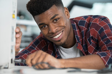 portrait of man holding cable for appliance