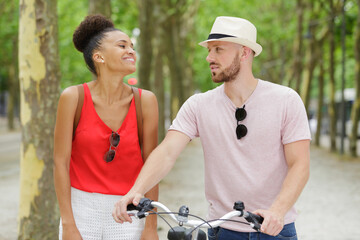 Obraz premium man with a bike woman standing next to him