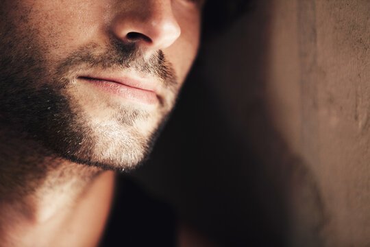 Hes got a chiselled jaw. Cropped image of the lower half of a handsome mans face.