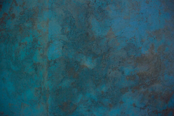 Photo of an old concrete wall tinted turquoise to use as a background