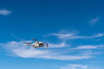 Drone in flight dynamics against the sky 