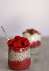 Close up of vegan chia pudding with yoghurt and raspberries