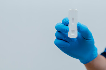 Own hand showing Covid-19 negative test result with SARS CoV-2 Rapid antigen test kit