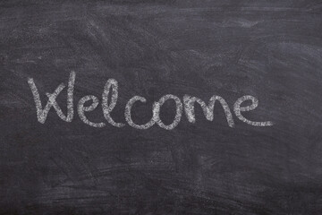 Welcome sign on chalkboard classroom school