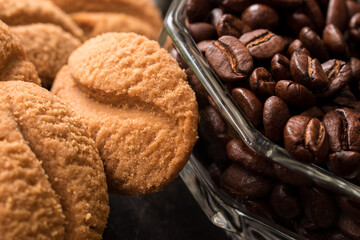 Coffee beans and coffee cookies  on black background