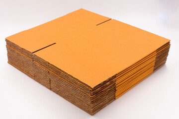 Brown cardboard boxes for packing parcels in online sales placed on a white background.