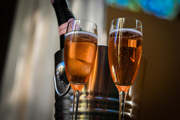 Champagne celebration with two glasses poured.