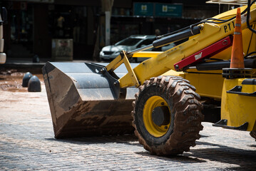 working bulldozer working on city streets