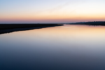 calm waters of Ria Formosa at sunset in Algarve, Portugal