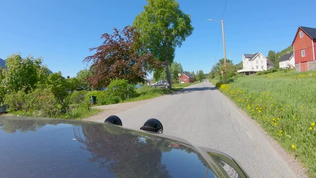 Driving in Northern Norway, Hood view through Norwegian Village with narrow Roads, Slow motion