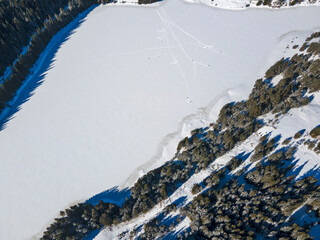 Aerial winter view of Beglika Reservoir covered with ice, Bulgaria