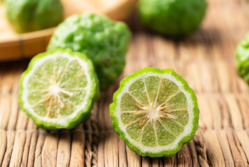Fototapeta na wymiar Organic Kaffir lime, Citrus fruit used in Southeast Asian cuisine and essential oil
