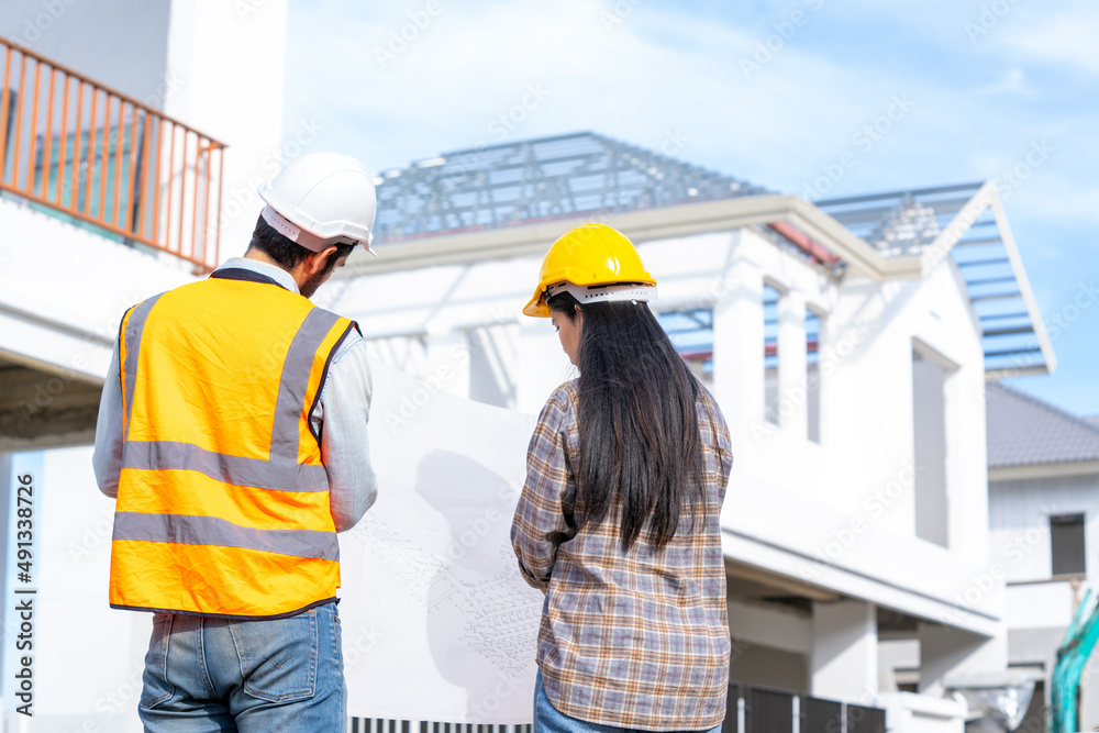 Aufkleber Architect and engineer discussing planning for a building a new home at construction site,Architect watching some a construction,Business, Building,Industry,People concept.
