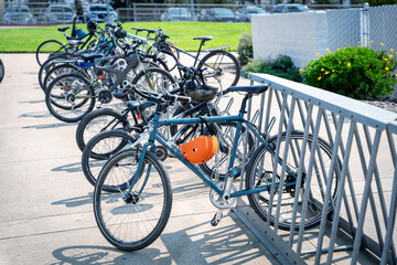 Bicycles in a rack at school, yard